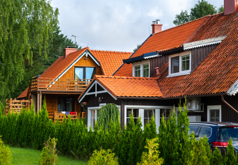 Traditional Red Tile Roof Apartment With Landscaping at Assisted Living Facility