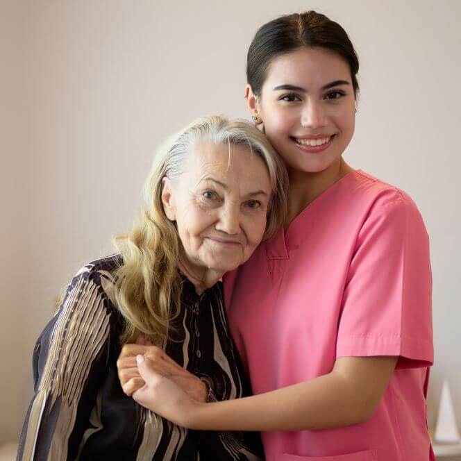 Caregiver Comforting Resident at Assisted Living Facility Caregiver Comforting Resident at Assisted Living Facility