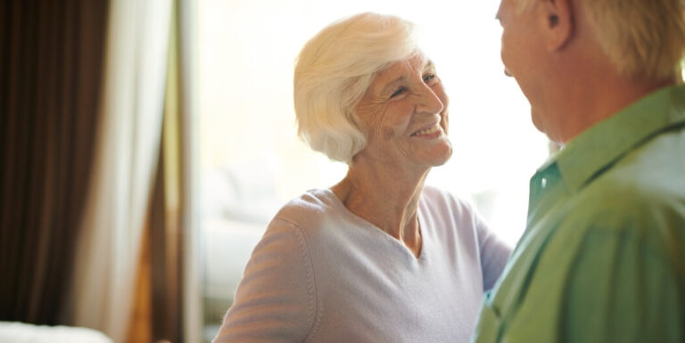 Elderly Couple Sharing a Moment Together Indoors at an Independent Living Facility