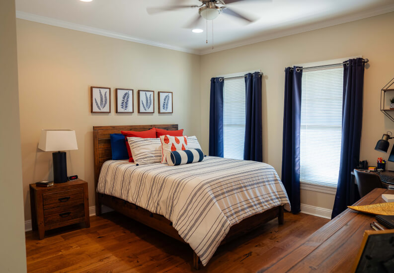 Furnished Bedroom With Hardwood Floors in Independent Living Cottages Furnished Bedroom With Hardwood Floors in Independent Living Cottages