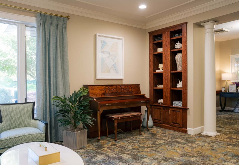 Piano Lounge With Built-in Bookshelves at Assisted Living Facility Piano Lounge With Built-in Bookshelves at Assisted Living Facility