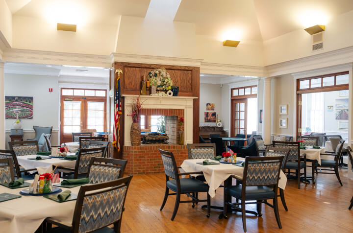 Restaurant-Style Dining Room With Brick Fireplace at Assisted Living Facility Restaurant-Style Dining Room With Brick Fireplace at Assisted Living Facility