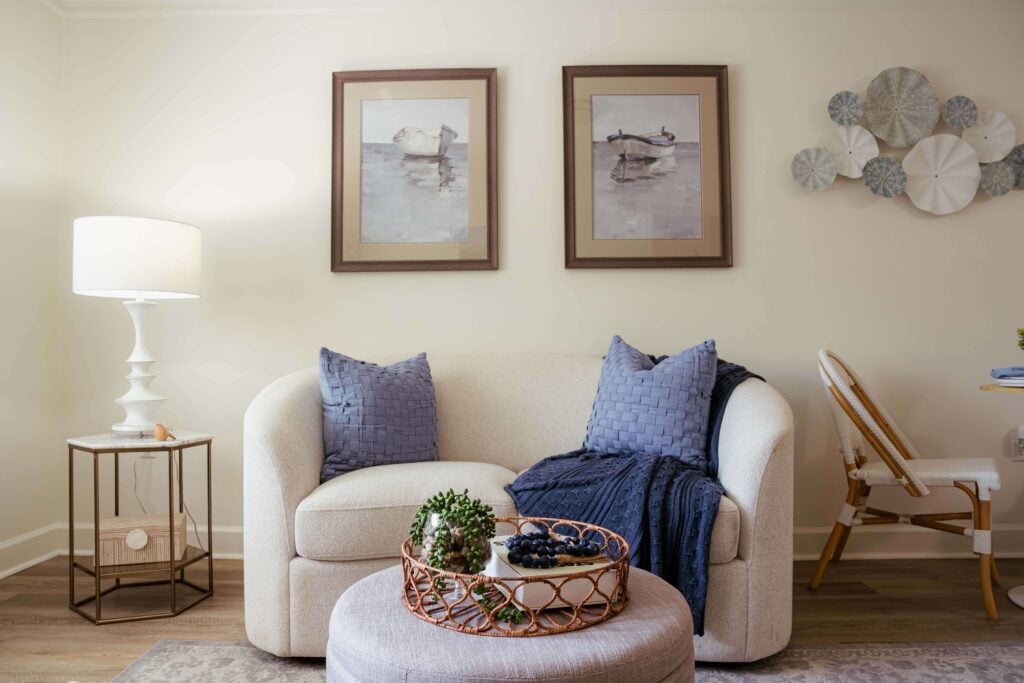 Curved Loveseat With Woven Blue Pillows at Assisted Living Facility