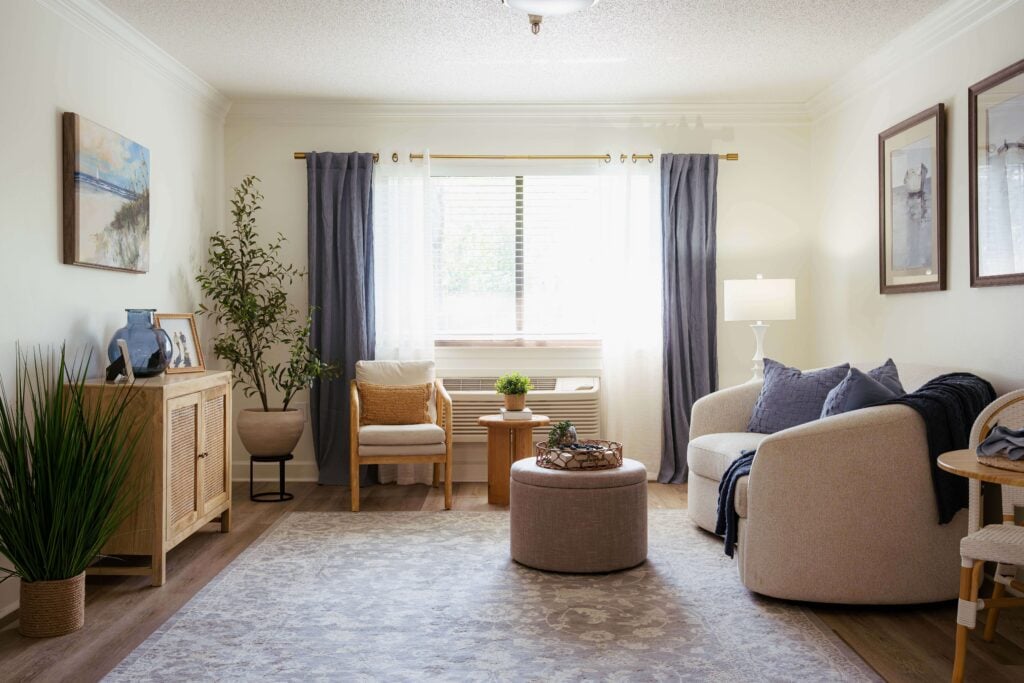 Sunlit Sitting Room With Neutral Decor at Assisted Living Facility