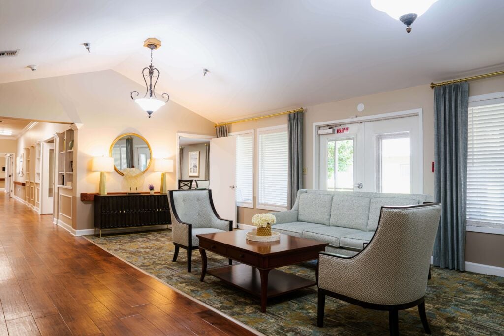 Open Common Area With Hardwood Hallway at Assisted Living Facility