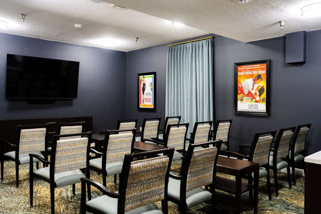 Movie Theater Room With Classic Film Posters at Assisted Living Facility